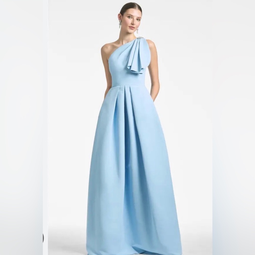 SACHIN & BABI 
Martina Gown in sky blue one shoulder embellished, pockets size 2